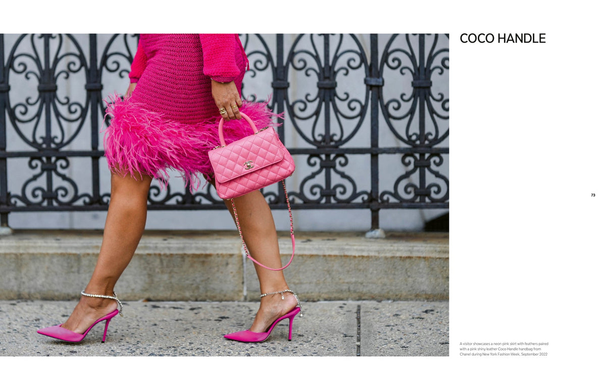 Person wearing a pink dress and high heels, holding a pink handbag with a decorative handle.