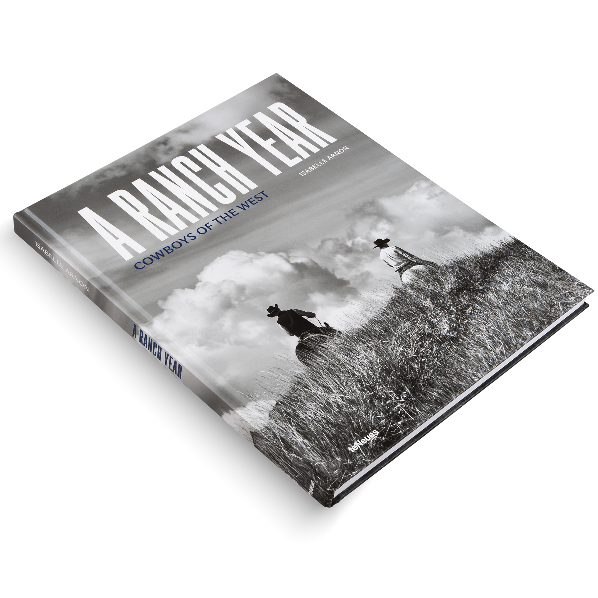 Book titled 'A Ranch Year: Cowboys of the West' with a black and white photo on the cover.