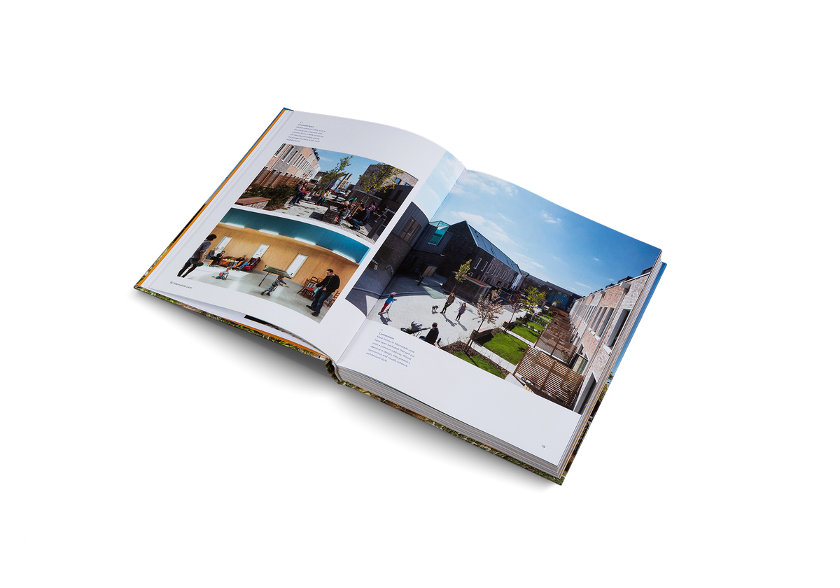 Shared communal areas, such as the courtyards, playroom, and common house, enable socializing and free play, particularly among the younger members of this micro neighborhood.