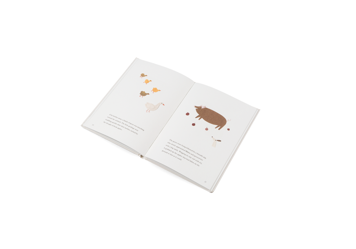 The geese were being followed by a friendly pig, who slowly approached Shiro and greeted her with a big smile. Wagging its tiny tail with joy, it gobbled up the apples that had fallen on the ground as fast as it could.