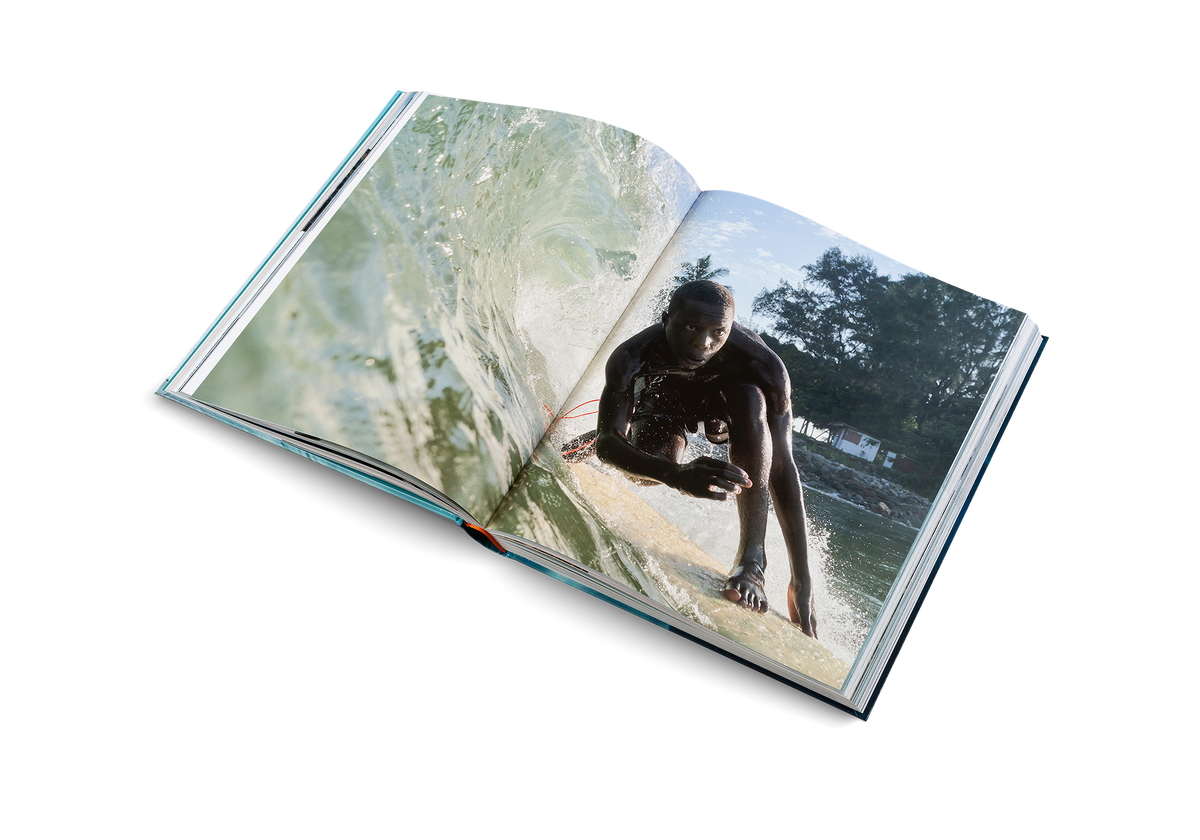 A surf on a wave in The Surf Atlas by gestalten and Luke Gartside