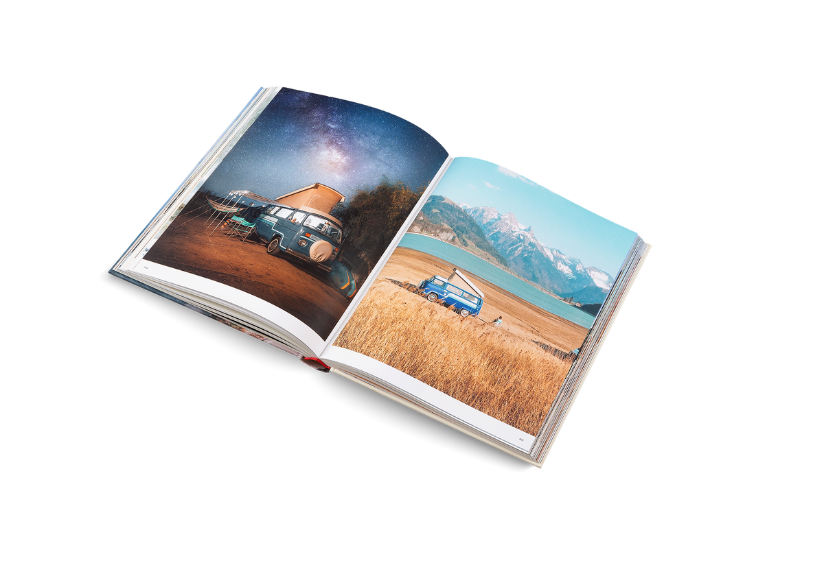 Two blue vans in the nature. Both are featured in The Getaways a book by gestalten.