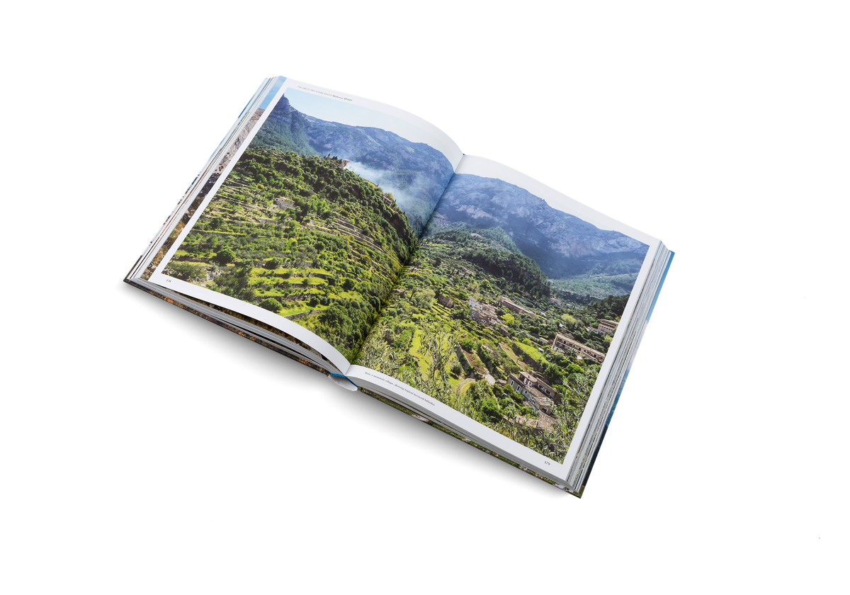 Deià, a mountain village, showing typical terraced hillsides is on the way of the GR221. Wanderlust Europe shows you the way through the dry stone route.