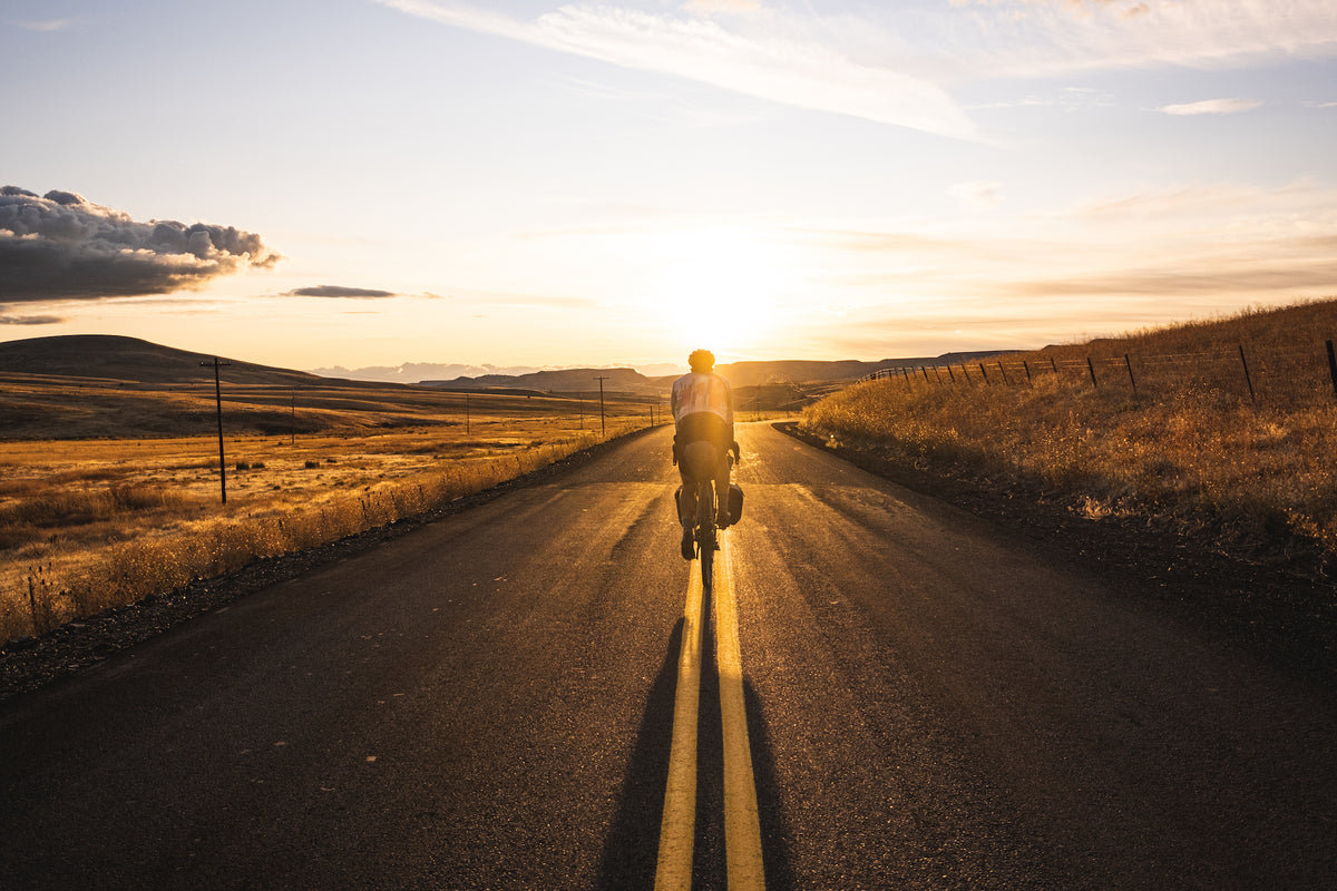 A bikepacker on the road in Bikepacking by gestalten and Stefan Amato