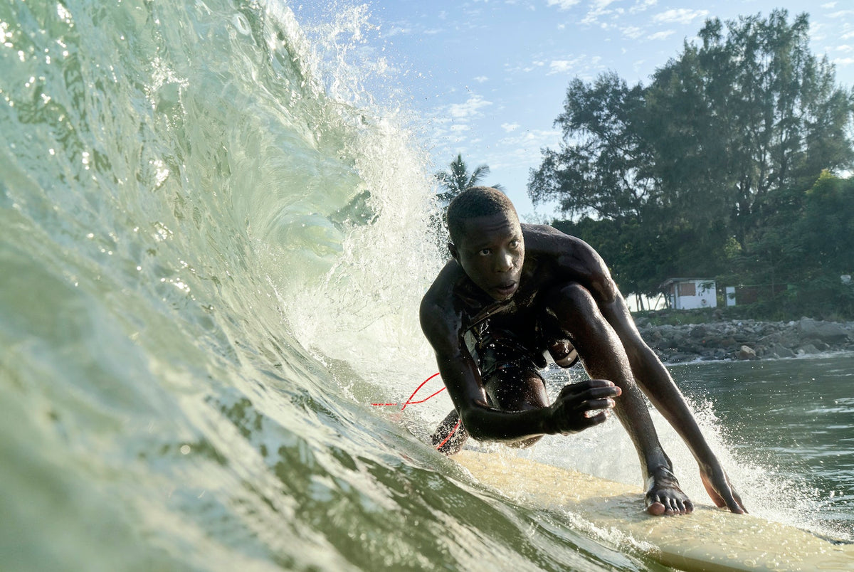 Tarkwa Bay is a small sandy strip of man-made beach located just outside the entrance of Lagos in Nigeria. There, a break wall creates perfect wedges. This accidental gift from the city’s civil engineers has spawned a lively surf scene. At its center are John Micheletti, an Italian who was born and raised in Nigeria, and Godpower Pekipuma, a Tarkwa local through and through. Discover this amazing surfing spot in The Surf Atlas by Luke Gartside