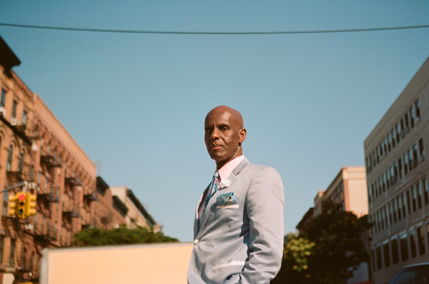 Street fashion icon Dapper Dan–born Daniel Day–posing on the streets of Harlem. (Photo: Thomas Welch)