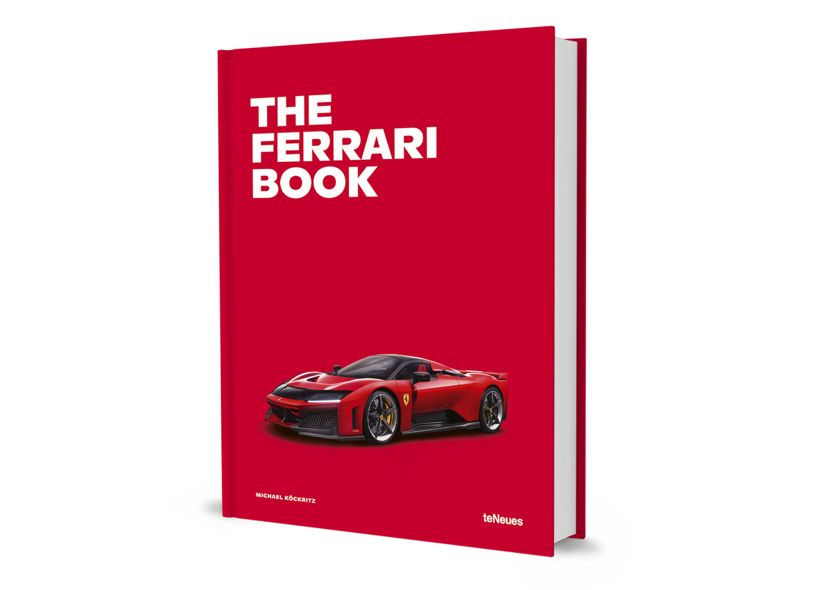 Book titled 'The Ferrari Book' with a red cover and Ferrari logo on a white background