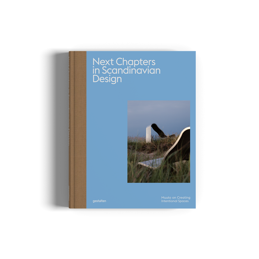 Book titled 'Next Chapters in Scandinavian Design' with a blue cover and wooden spine on a white background