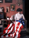 Image: Portrait of his wife stitching an American flag by Mr. Benjamin F. Russell, ca. 1910. The Colors of Life, gestalten 2023
