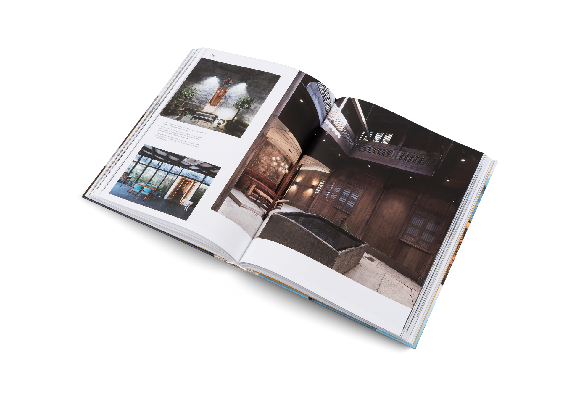 The main entrance hall of the Wuyuan Skywells Hotel is a grand double-height space with flagstone flooring, elegant wood paneling, and a gallery lined with intricate latticework in Beauty and the East by gestalten.