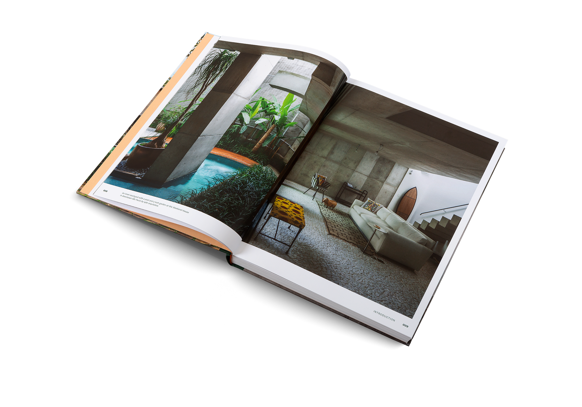 An inner courtyard with a pool and a lush garden at the Weekend House in downtown São Paulo by spbr arquitetos.