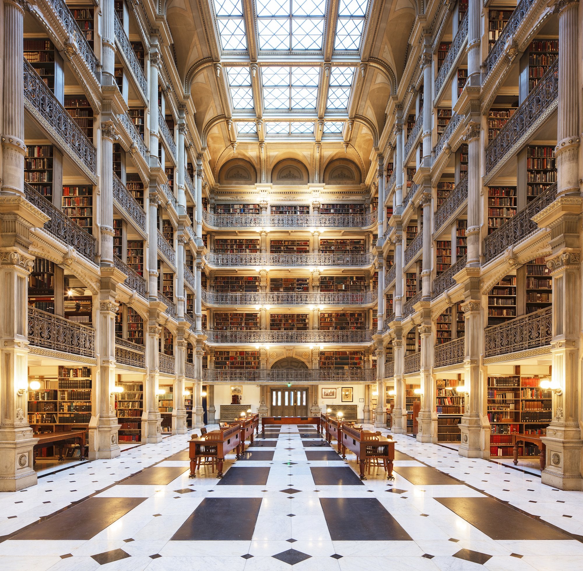 Sunlight streams down through the huge skylight, illuminating the six floors of the George Peabody Library. With its lovingly sculpted columns, arches, and cast-iron balconies, this library has a deserved reputation as one of the most beautiful in the world.