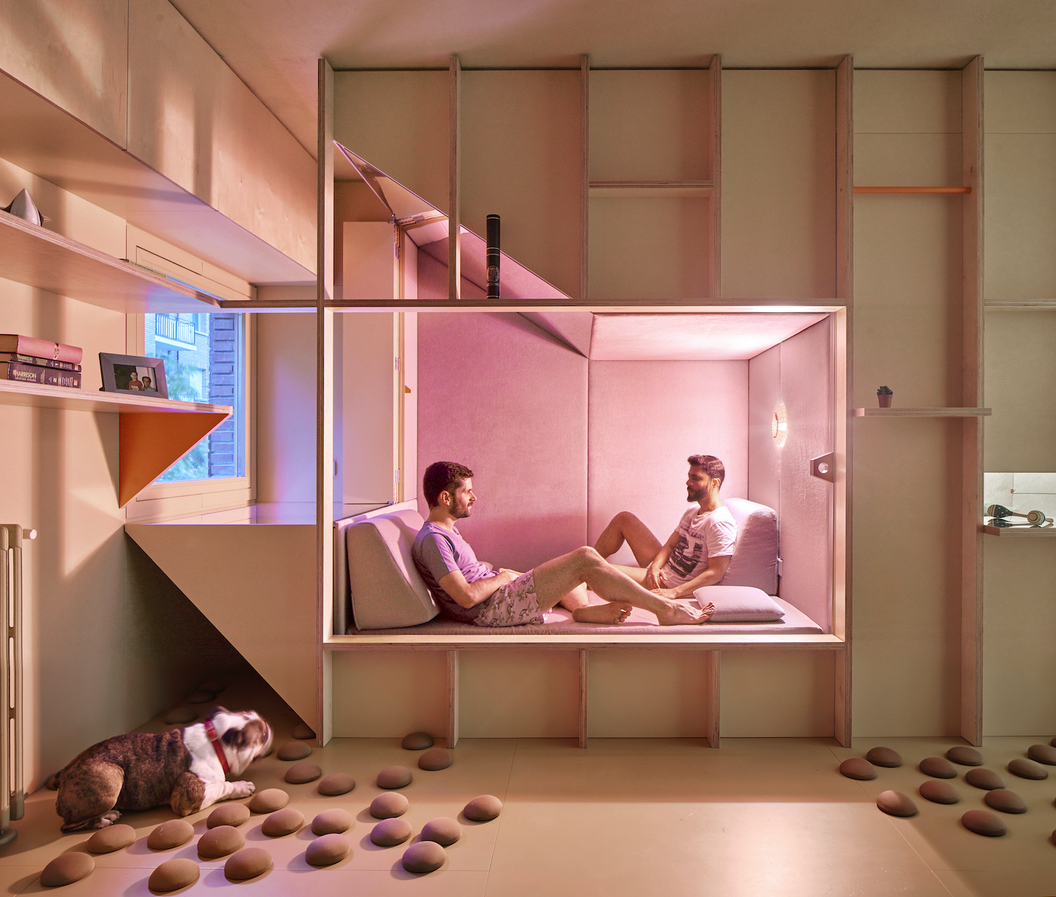 Homes that help you inhabit a small space together while maintaining levels of privacy and individuality can help. Athens-based architecture practice SOUTH, for example, transformed an unused basement space in the Greek capital into a 40m2 (431ft2 ) custom studio apartment. While basement apartments tend to evoke images of cramped, windowless, damp spaces, this one, located in the Lycabettus Hill area, is quite the opposite.