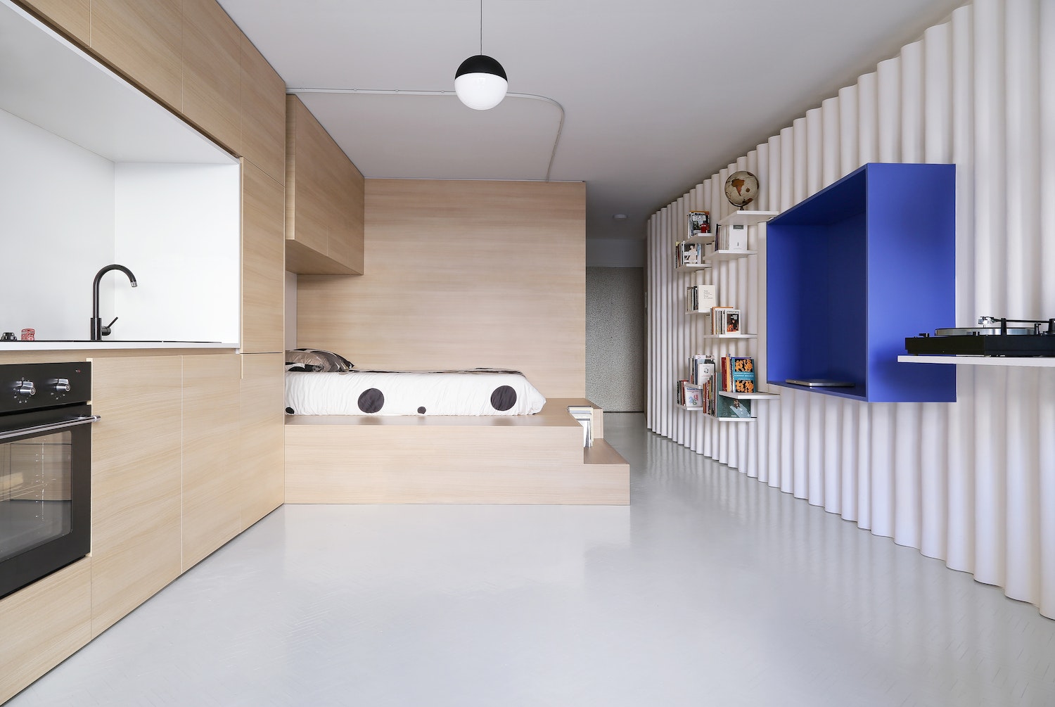 The architect of this project featured in Pretty Small was inspired by the clients’ Greek heritage and chose to infuse the home with the colors of their homeland—the traditional bright-white paint found in Greek architecture and the blue of the Aegean Sea.