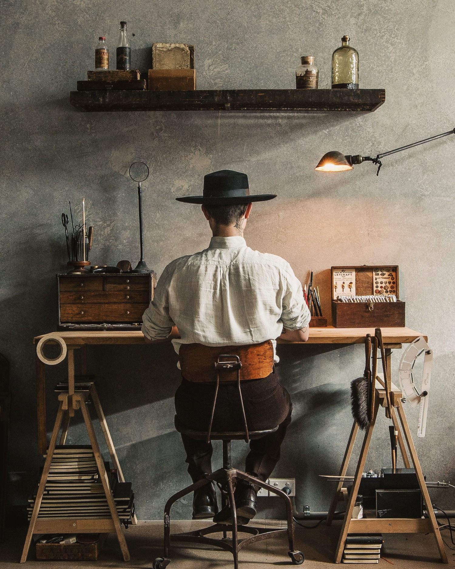 Christian Watson working in his atelier. 1924us is the branding studio that he created in Australia.