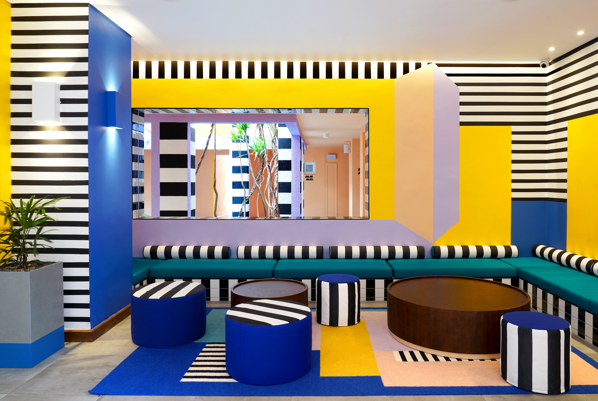 There are few designers who have created a body of work that is so them it’s unmistakable. London-based Camille Walala is among them. Be it a bouncy castle outside a London office building, a cushion, or this boutique hotel in Mauritius, her work is unified by its use of punchy colors, its graphic quality, and its vibrant patterns. That’s exactly what enamored the client at the Salt of Palmar boutique hotel. Find more about it in House of Joy by gestalten.